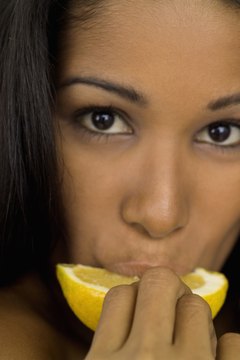 Medioimages/Photodisc/Photodisc/Getty Images Sour citrus stimulates saliva release.