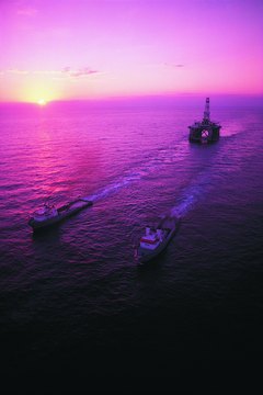 Burials at sea are traditionally conducted aboard a ship.