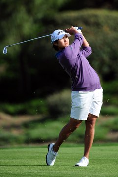 Harry How/Getty Images Sport/Getty Images Yani Tseng carries both irons and hybrids in her golf bag.