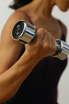 Ryan McVay/Photodisc/Getty Images Use free weights, body weight and machines for your arm training.