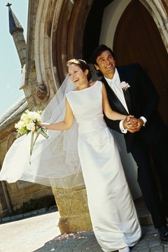 Stockbyte/Stockbyte/Getty Images Don't forget to change your name on loan documents after getting hitched.