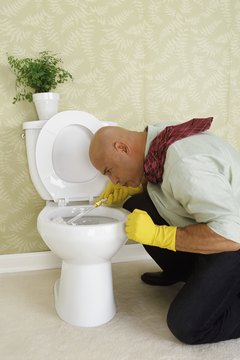 Man Scrubbing a Toilet