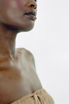 Digital Vision/Digital Vision/Getty Images Get rid of thin shoulders with regular strength training.