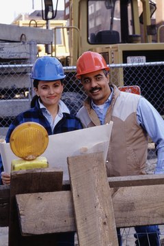 Dick Luria/Photodisc/Getty Images As highly paid trades workers, construction supervisors interpret blueprints for subordinates.