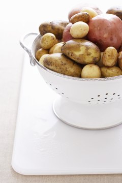 Martin Poole/Digital Vision/Getty Images Potatoes come in different colors and sizes.
