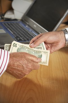 David Woolley/Lifesize/Getty Images Paying with cash saves on interest and fees.