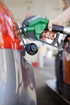Jupiterimages/Polka Dot/Getty Images State and federal taxes make up about 50 cents of the cost of a gallon of gas.