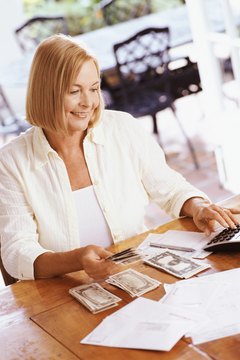 Flying Colours Ltd/Digital Vision/Getty Images File an itemized tax return to use your mortgage interest as a deduction.