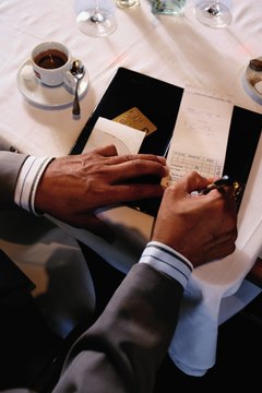 Man paying restaurant check, elevated view, close-up