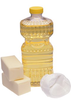 Stockbyte/Stockbyte/Getty Images For convenience, you can store used cooking oil in an empty original container.