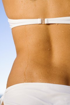 Goodshoot/Goodshoot/Getty Images Try Reformer Pilates to tone the waist.