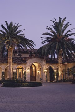 Comstock/Comstock/Getty Images Use native plants in your landscaping to cut the expense of transporting and maintaining non-native species.