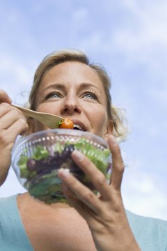 Jupiterimages/Goodshoot/Getty Images Carbohydrates start breaking down in your mouth.
