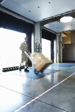 Man delivering boxes in loading bay (blurred motion)