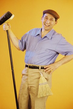 Janitor posing with broom