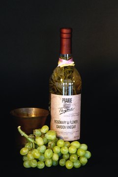 Jupiterimages/Photos.com/Getty Images Make your own grape-and-rosemary-infused vinegar to add flavor to your meals.