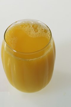 Jupiterimages/Comstock/Getty Images Squeeze your own juice to ensure that it is 100 percent pure.