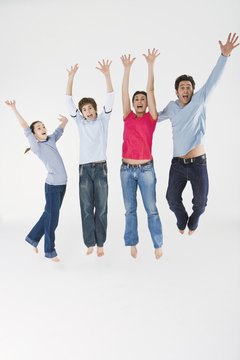 Jupiterimages/Polka Dot/Getty Images Vertical jumps exercise both the hamstrings and quadriceps.