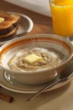 Liquidlibrary/liquidlibrary/Getty Images Have some orange juice to improve iron absorption from grits.