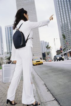 Stockbyte/Stockbyte/Getty Images While a backpack might feel comfortable, it clashes with your professional image.