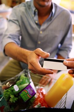 Stockbyte/Stockbyte/Getty Images Keep debt in check by using a reactivated card for necessary purchases.