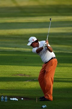 PGA Tour golfer Phil Mickelson practices his pitching-wedge shots.