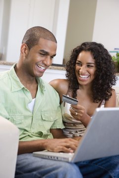 Creatas Images/Creatas/Getty Images Get on the same financial page to improve your credit scores.