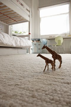 Martin Poole/Lifesize/Getty Images Light-colored carpeting makes small rooms look larger.