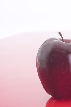 Photos.com/AbleStock.com/Getty Images Apple cider vinegar is made from fermented, pulverized apples.