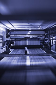 black and white time lapse view of a running printing press