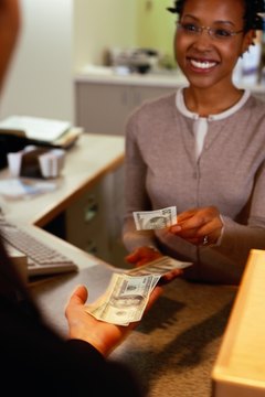 Ryan McVay/Photodisc/Getty Images When your child has a bank account, he can start saving money.
