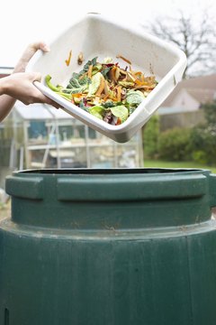 Martin Poole/Digital Vision/Getty Images Barrel composters require an exact balance of green and woody scraps (see References 1, page 4).
