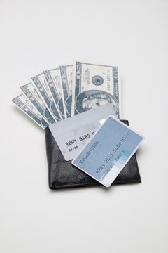Creatas/Creatas/Getty Images Paying with cash won't build your credit score, but using credit cards can.