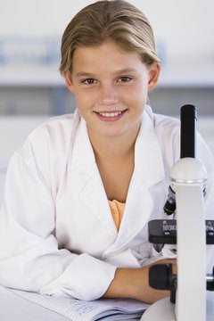 Jupiterimages/Goodshoot/Getty Images Curriculum designers create materials used in elementary through college science classes.