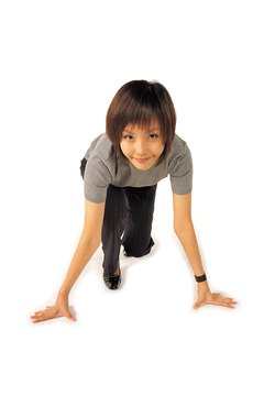 Jupiterimages/Photos.com/Getty Images The bear crawl targets all of your major muscle groups.