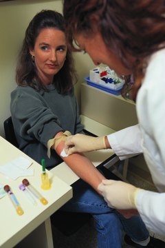 Keith Brofsky/Photodisc/Getty Images Phlebotomists specialize in drawing blood.