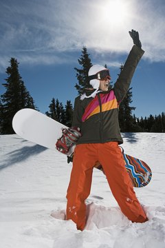 Brand X Pictures/Brand X Pictures/Getty Images Polarized lenses reduce the glare you'll experience while snowboarding.