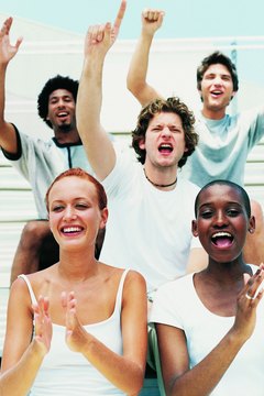 Students cheer from the bleachers.