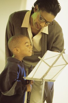 Comstock/Comstock/Getty Images Music teachers open their students' eyes to the joys of music.