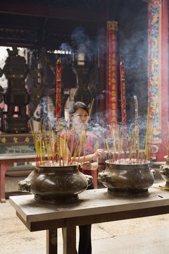 Buddhist incense is burnt to purify the area around the deceased.