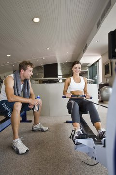 Jupiterimages/Goodshoot/Getty Images Ellipticals offer limited muscle use compared to rowing machines.
