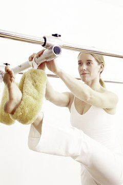 Brand X Pictures/Brand X Pictures/Getty Images The trapeze was one of the original pieces of Pilates equipment.