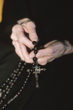 Both Anglican and Catholic rosaries contain a cross.