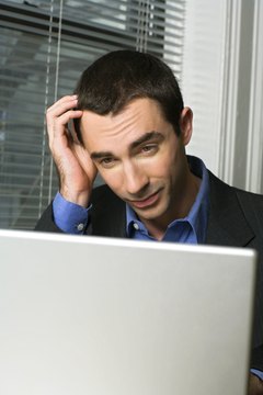Creatas Images/Creatas/Getty Images Knowing when to pay off debts can be confusing.