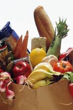 Jupiterimages/Photos.com/Getty Images Shopping with a grocery list can help you stick with your weight loss plan.