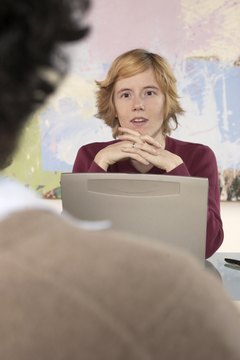 Jupiterimages/Photos.com/Getty Images Employee involvement in evaluations can improve morale in a work group.