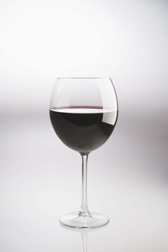 Jupiterimages/Comstock/Getty Images Red wine may have heart benefits, but limit consumption to one to two drinks per day.