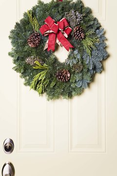 Jupiterimages/Brand X Pictures/Getty Images Craft an elegant wreath to hang from your front door.