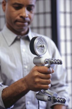Keith Brofsky/Photodisc/Getty Images A dynanometer is a common device used in isokinetic exercises.