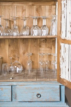 Jupiterimages /Polka Dot/Getty Images Strip your furniture before decorating it.